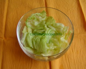 Lettuce pieces in a glass salad bowl